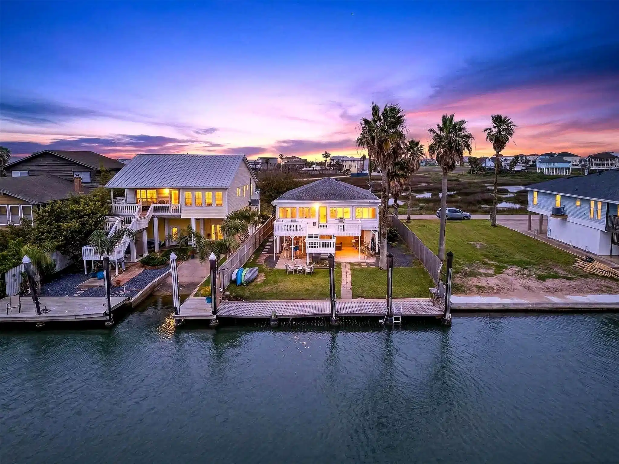 Image 1: twilight photo view of the home