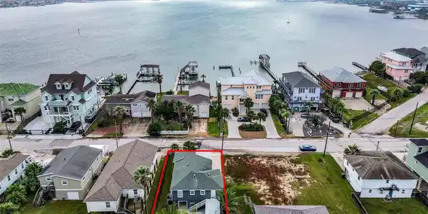 Image 2: Aerial shot emphasizing the home&rsquo;s location near t