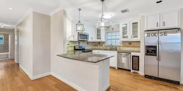 Image 3: Open-concept kitchen designed for connection, feat