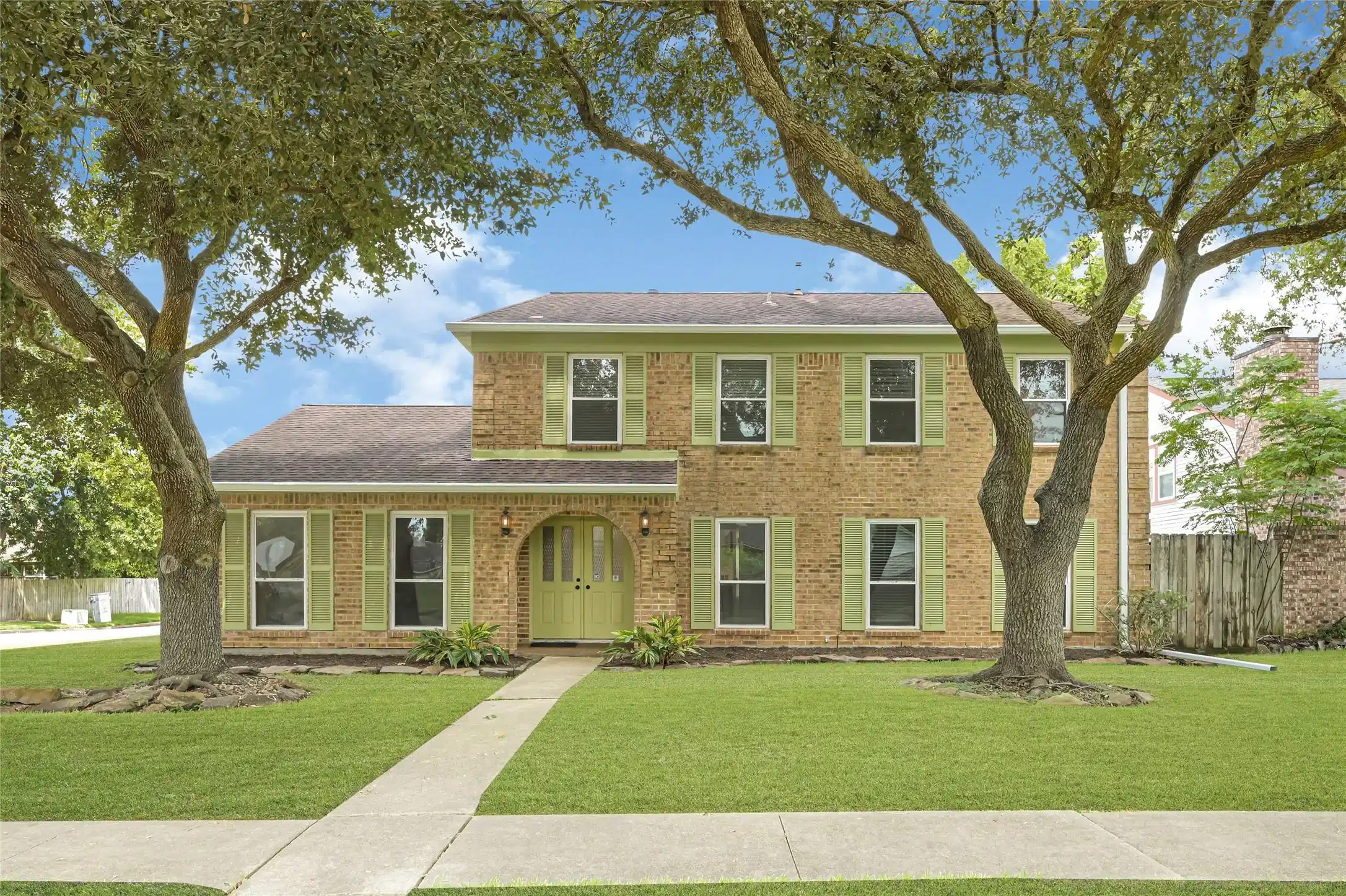 Image 1: Beautiful two story elevation with mature shade tr