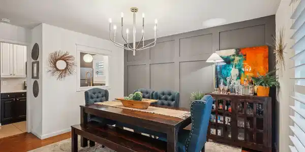Image 3: Dining area with nice accent wall and unique light