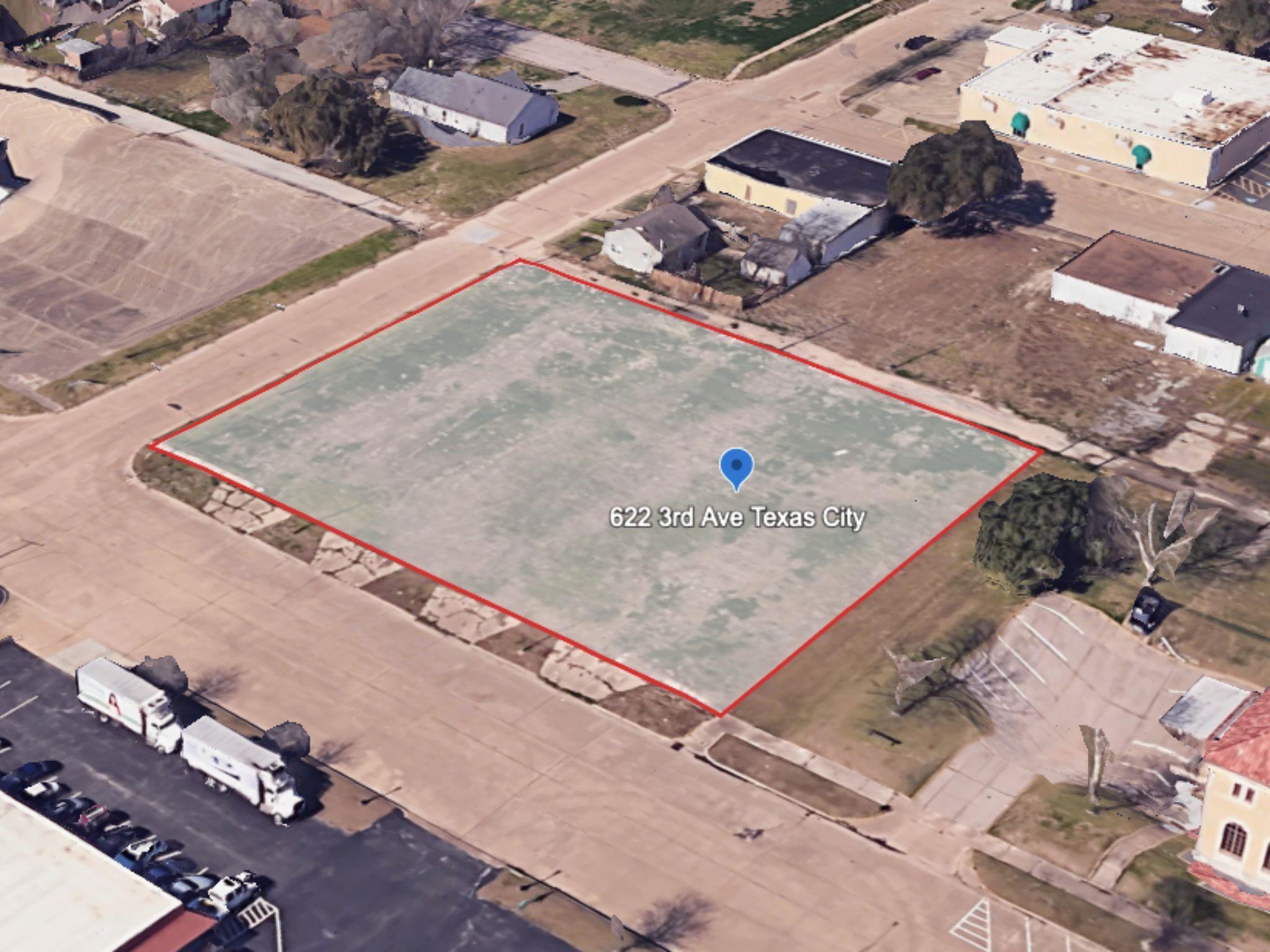 Image 1: Corner aerial view highlighting the full vacant lo