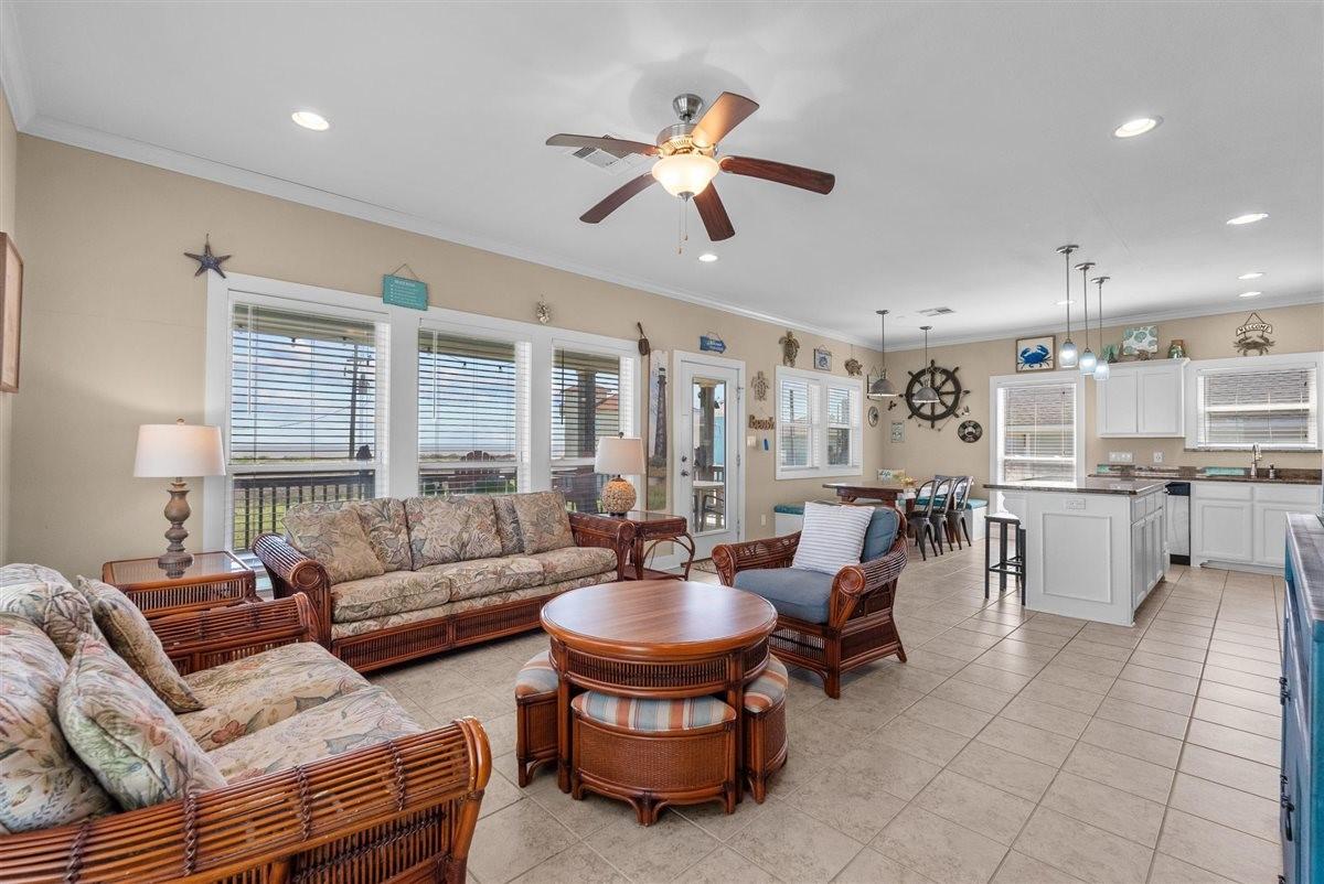 Image 4: The living room with its large windows allows for