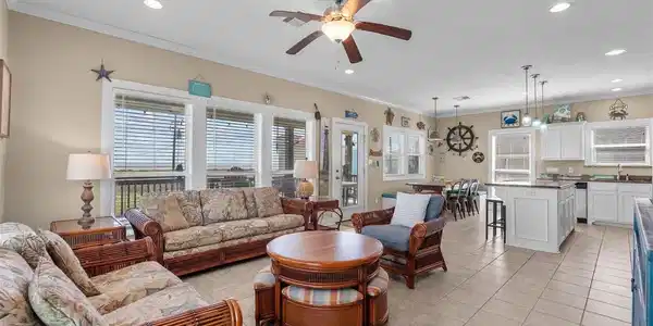 Image 4: The living room with its large windows allows for