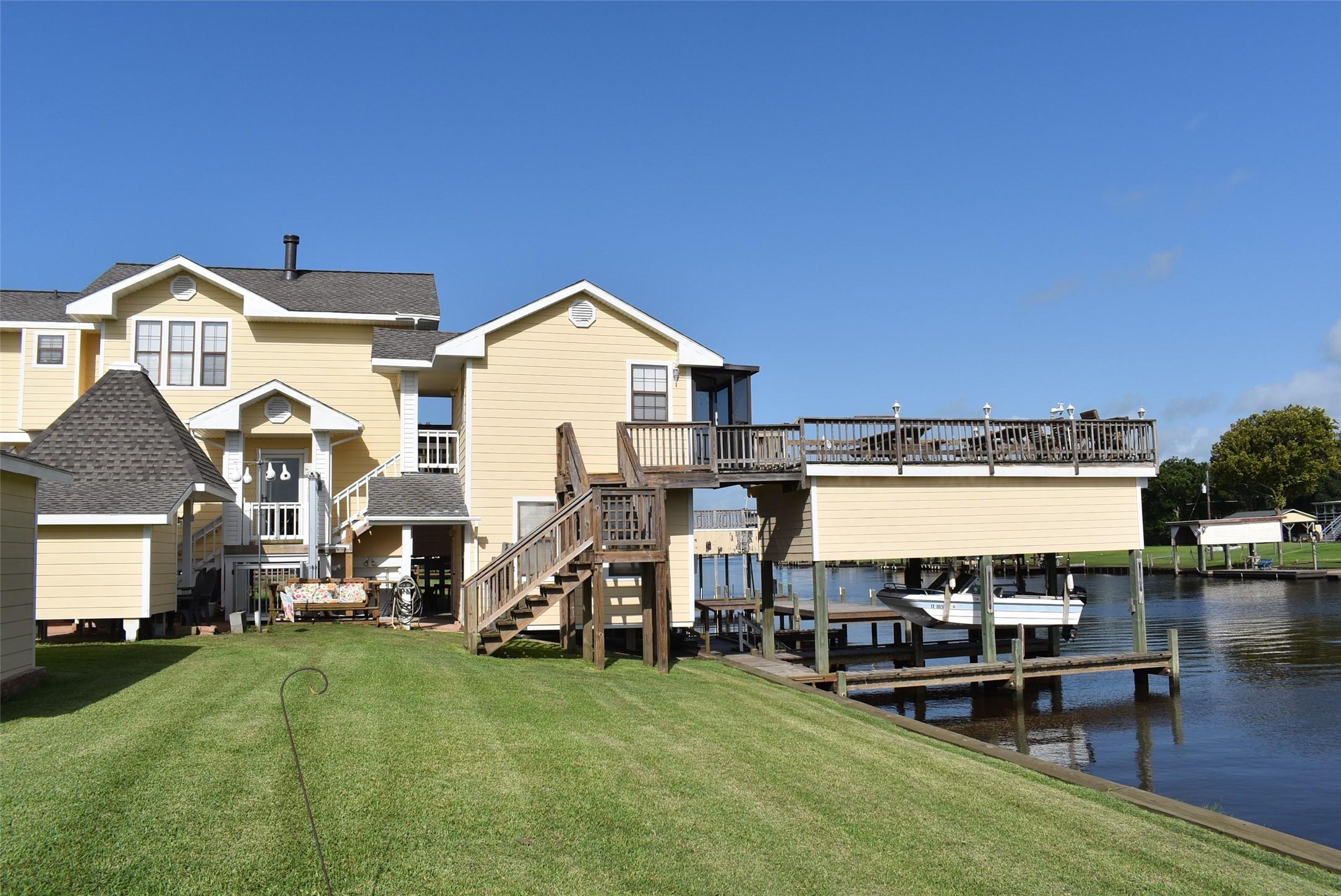 Image 1: Boat house with several piers