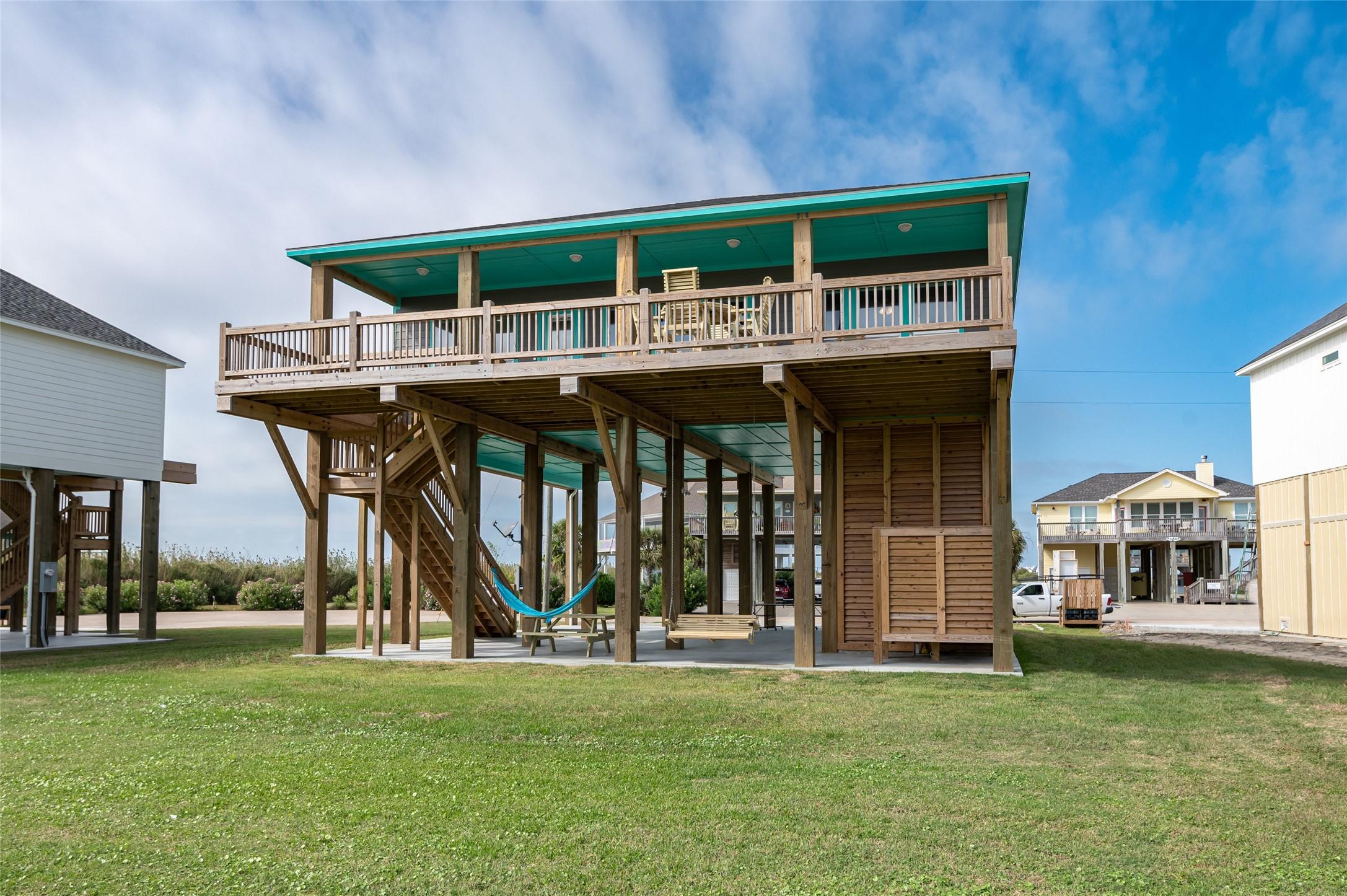 Image 3: Elevated beach house exterior showcasing the spaci