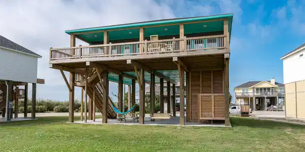 Image 3: Elevated beach house exterior showcasing the spaci