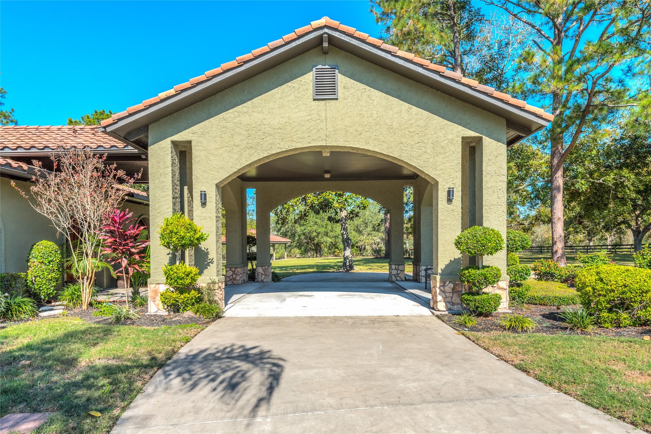 Image 4: The home features a beautiful tile roof (with 100-