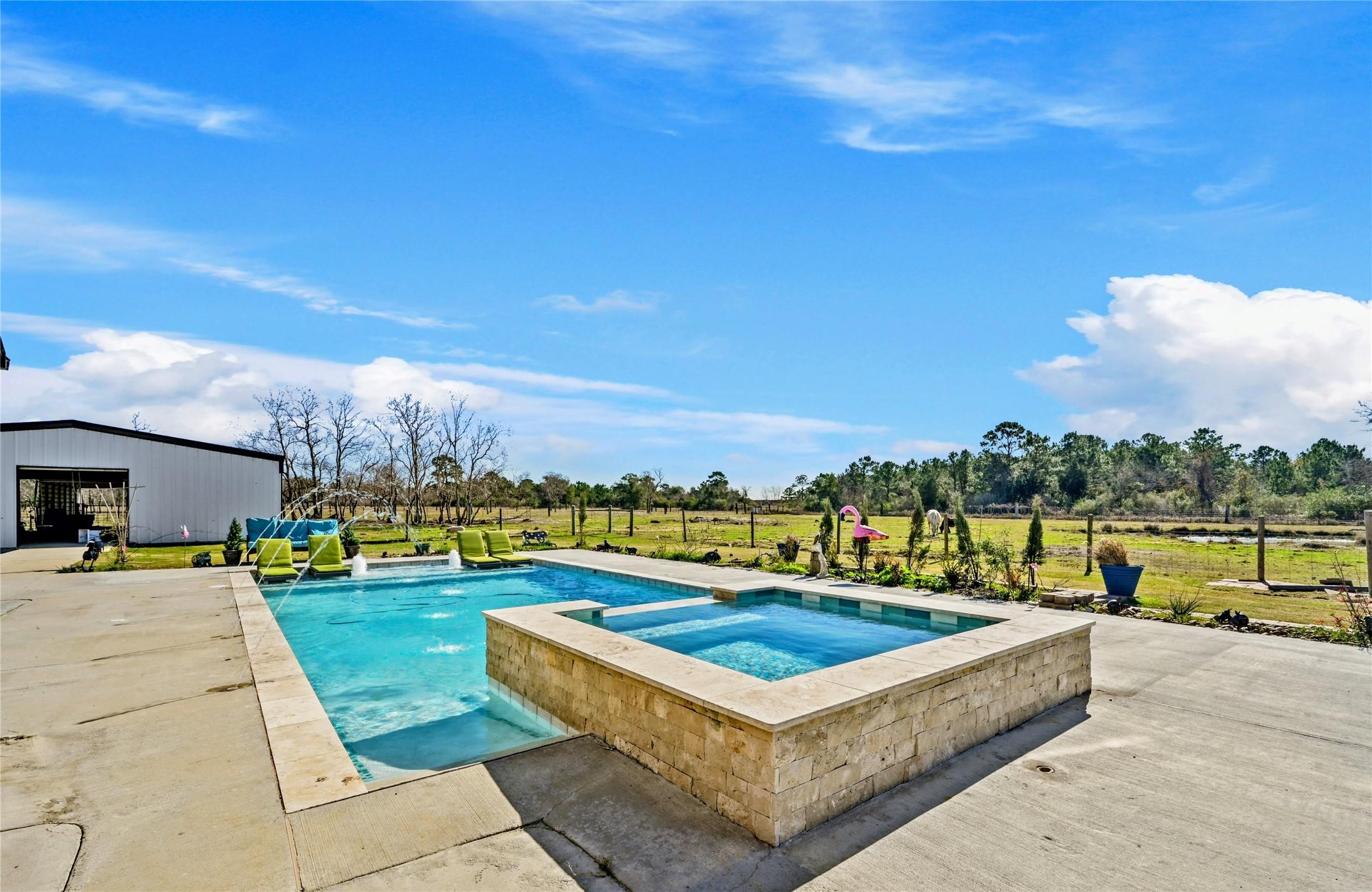 Image 4: 20x40 heated pool with 8x8 hot tub with waterfall.