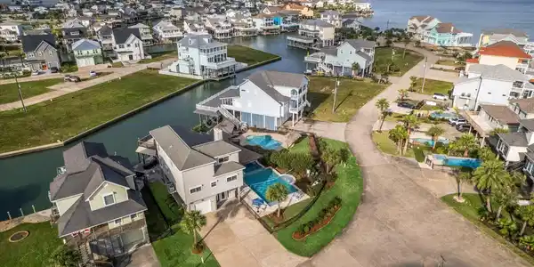 Image 2: Tiki Island features lush landscaping, private dri
