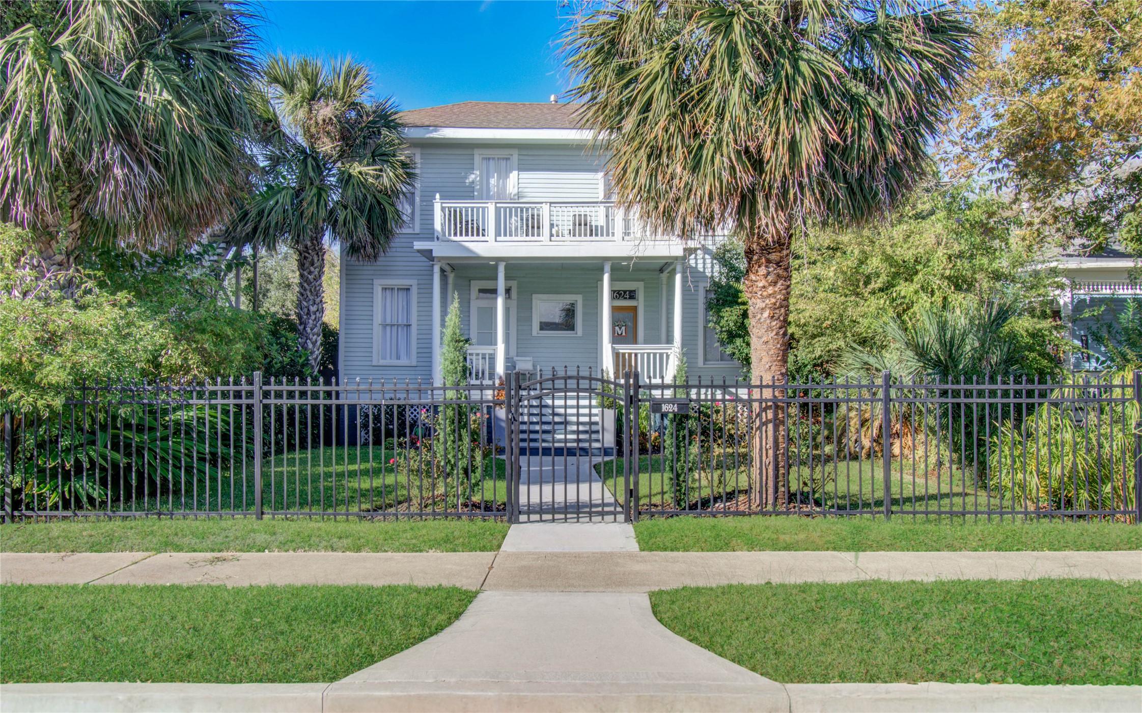 Image 4: This charming home features a classic two-story de