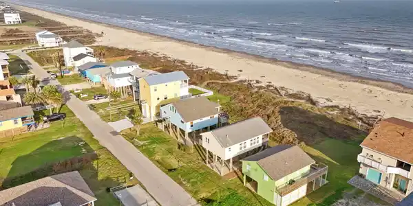 Image 3: The sale of the home will include the beachfront p