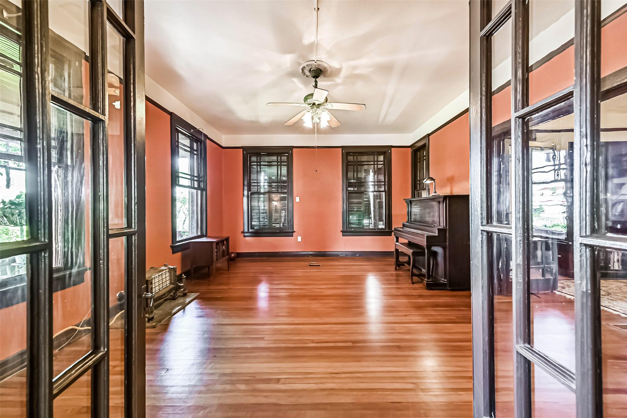 Image 4: Looking From the Entryway, These Double Doors Lead
