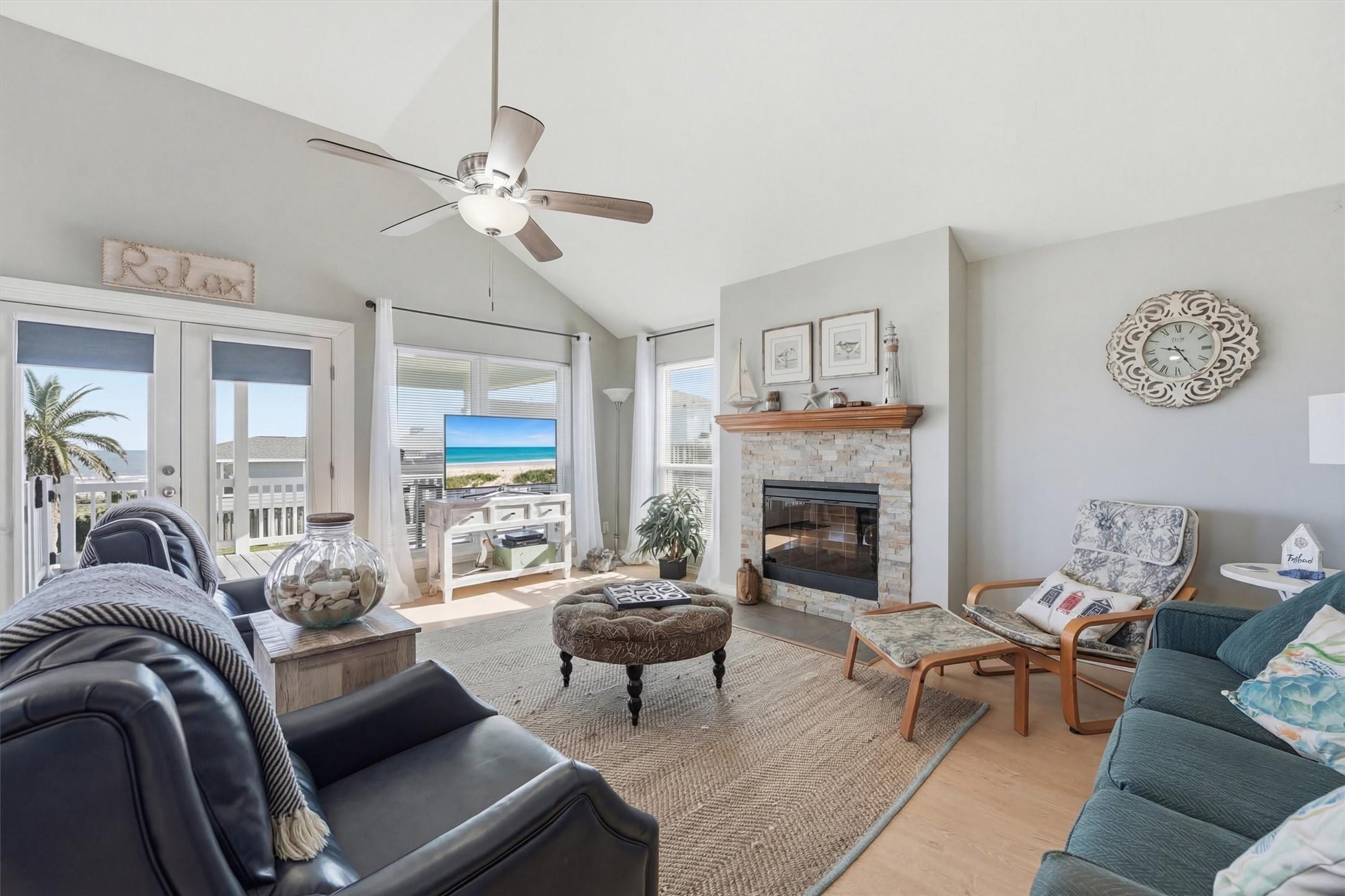 Image 4: Bright living area with vaulted ceilings, fireplac