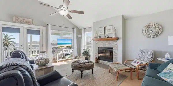 Image 4: Bright living area with vaulted ceilings, fireplac