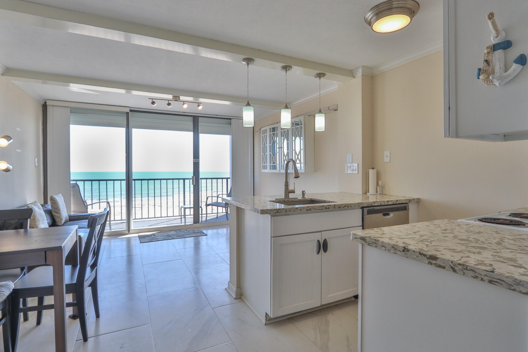 Image 4: The view is gorgeous from all of the living space!
