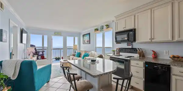 Image 2: Top floor corner unit with a view of both the sunr