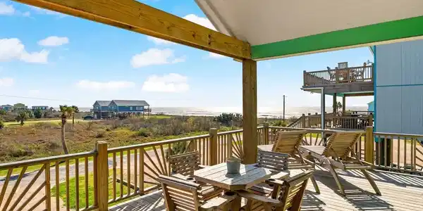Image 2: Spacious wooden deck with comfortable seating, off
