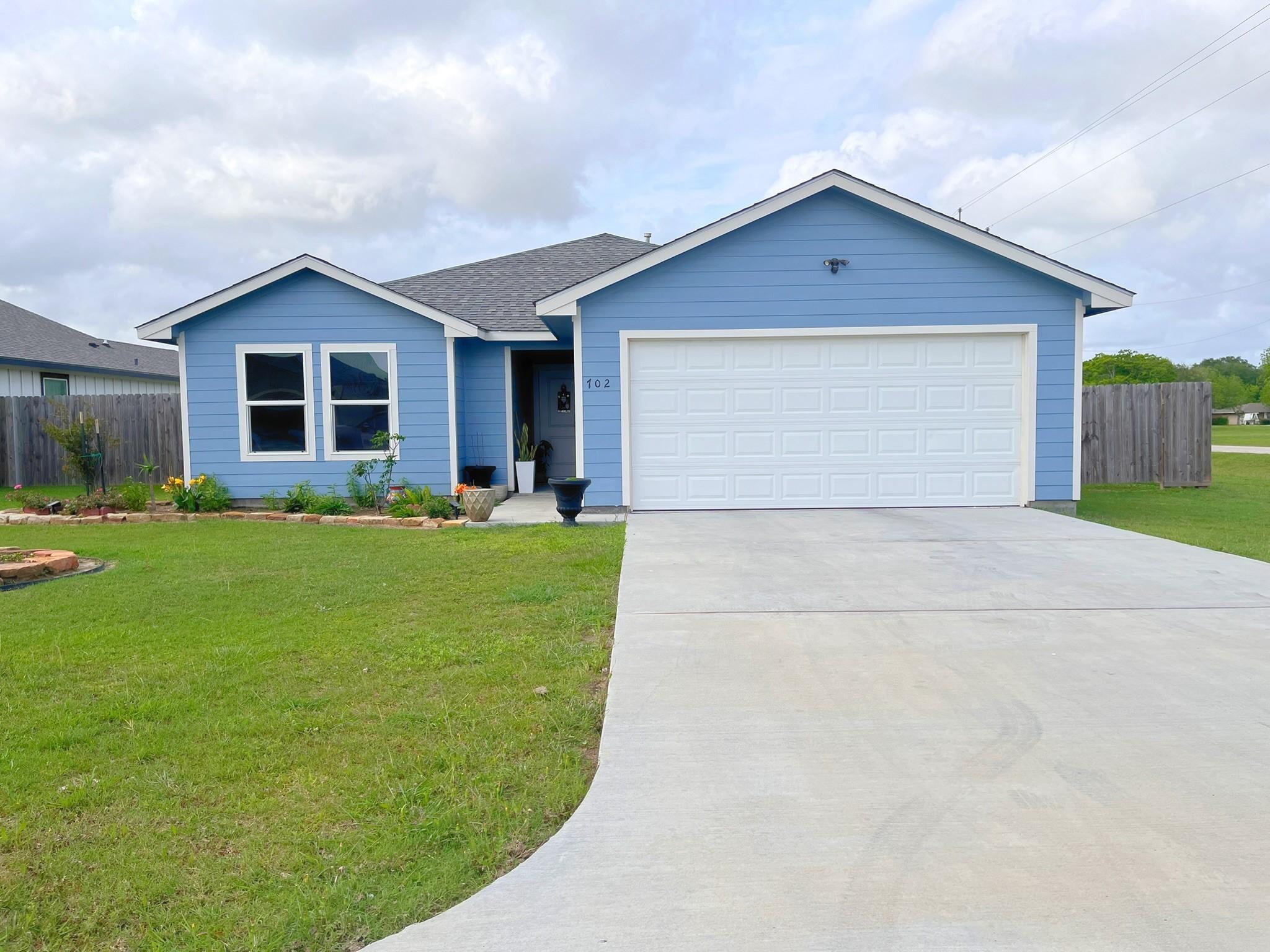 Image 1: Charming home with an attached two-car garage, per