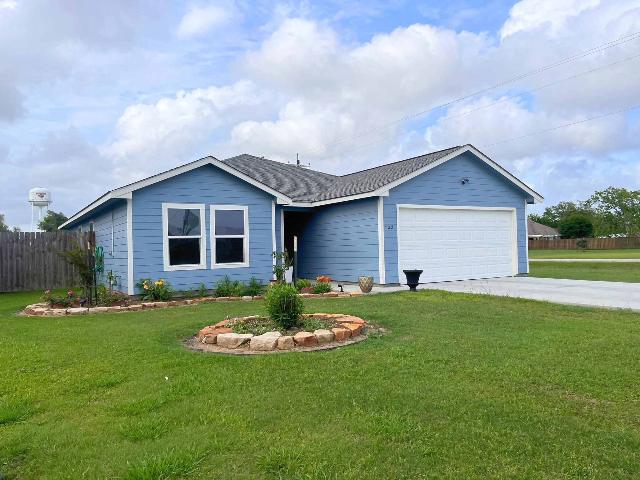 Image 3: Charming and inviting front exterior with a spacio