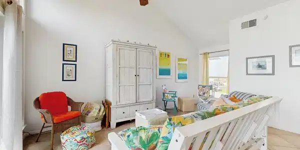 Image 2: The spacious living room is filled with natural li