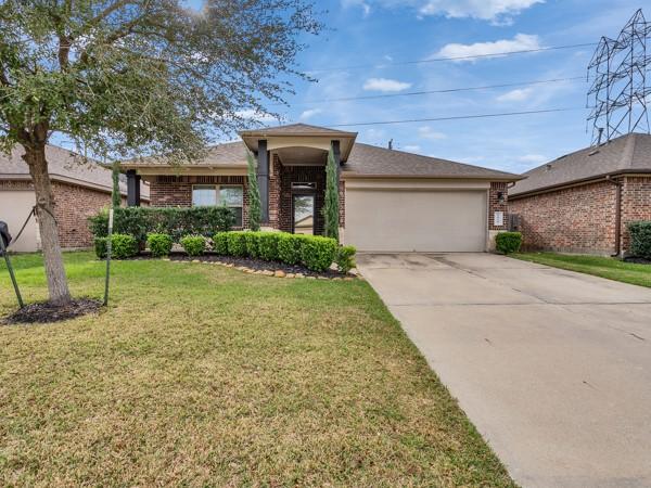 Image 2: This is a charming 3 bedroom single-story brick ho