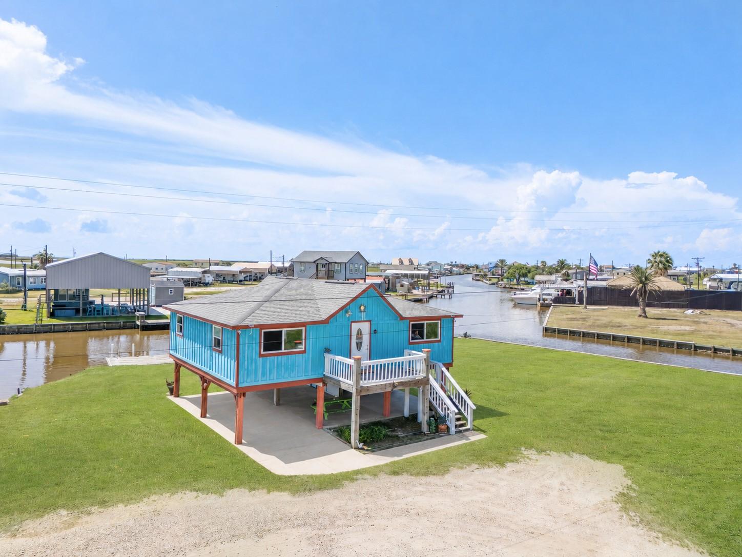 Image 2: Front and back upstairs decks along with covered p