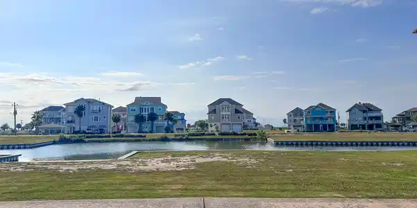Image 3: Street view showcasing the homesite to the right,