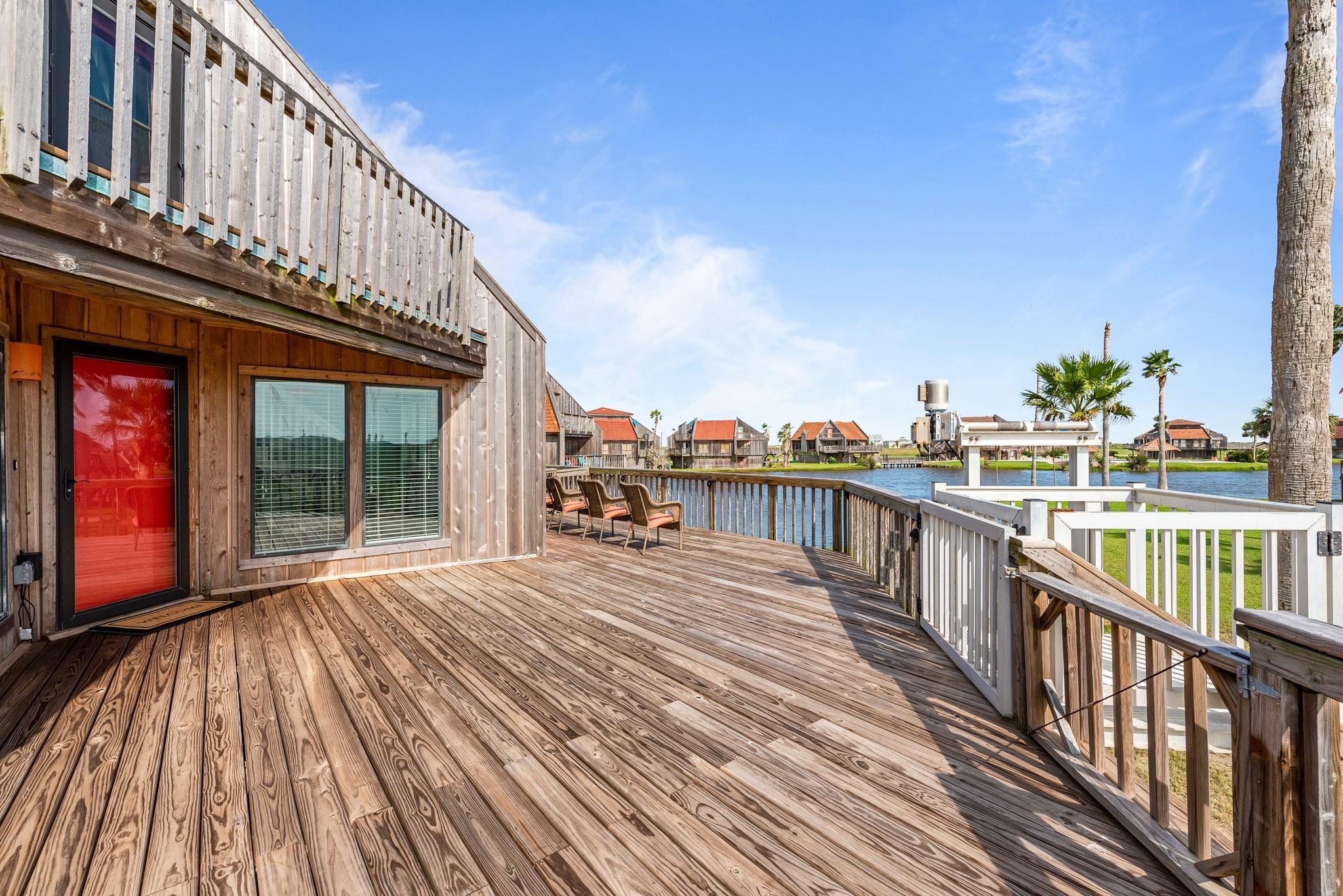 Image 3: Expansive covered downstairs patio and two large d
