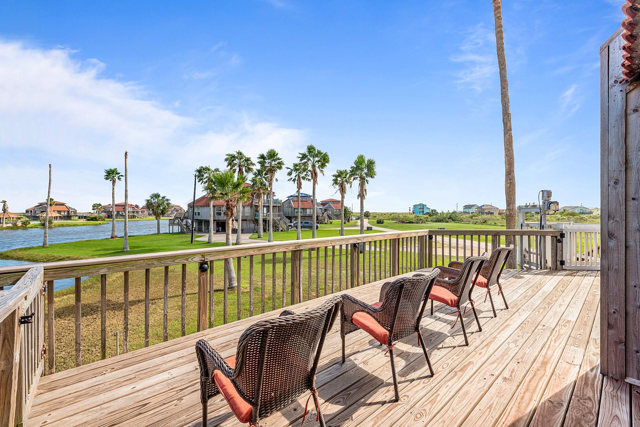 Image 4: Covered patio and two large decks overlooking the