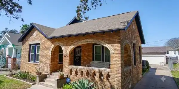 Image 2: Long driveway with a large garage in the rear offe