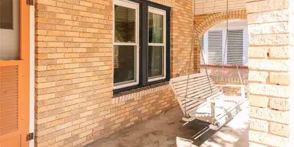Image 3: Shaded front porch is the perfect spot for a relax