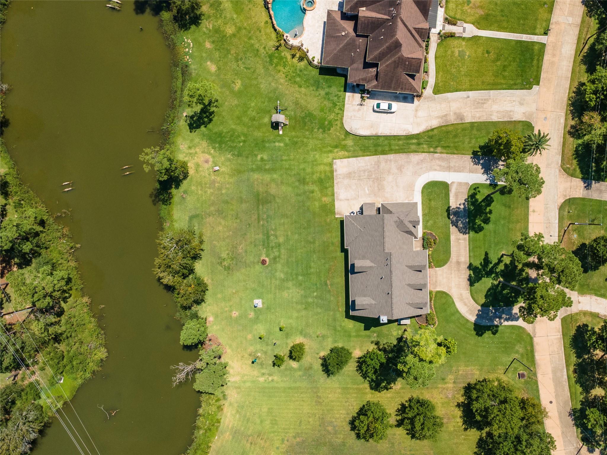 Image 2: Nestled on nearly an acre along the serene waters