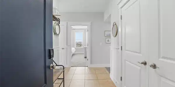 Image 4: Step inside to a bright, clean entry with tile flo