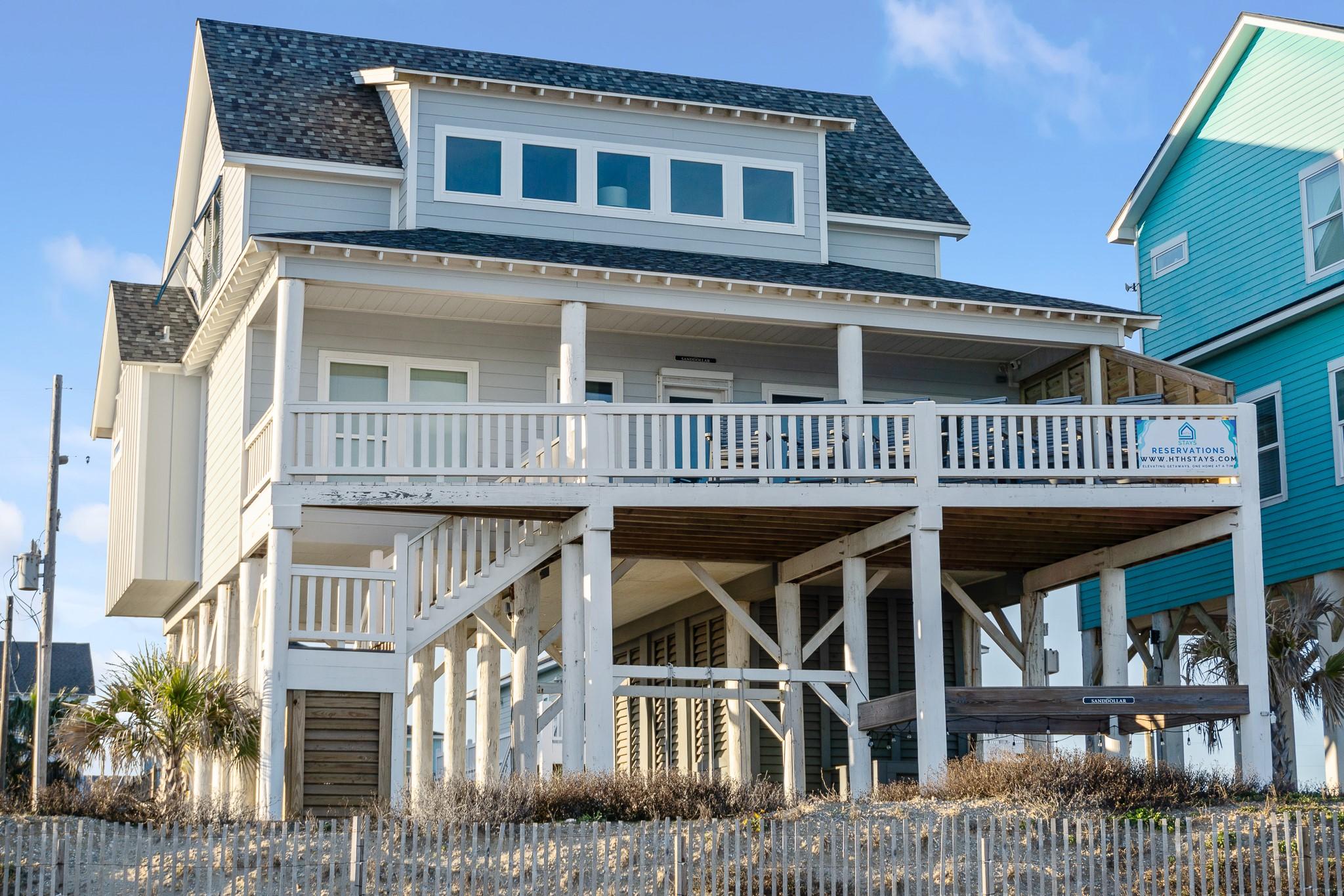 Image 3: Stylish coastal architecture with wraparound decks