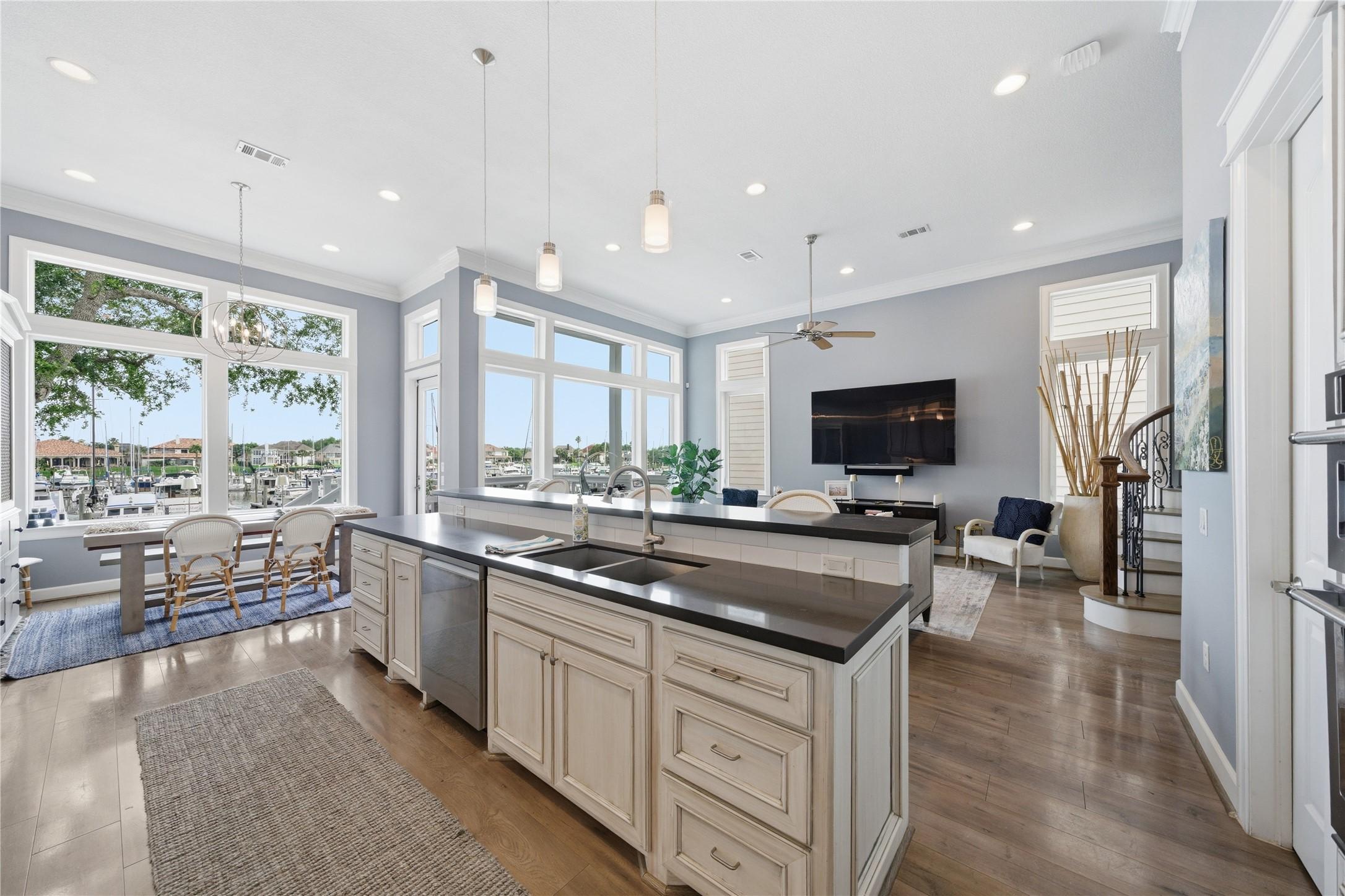 Image 4: The open concept kitchen/family room has a wall of