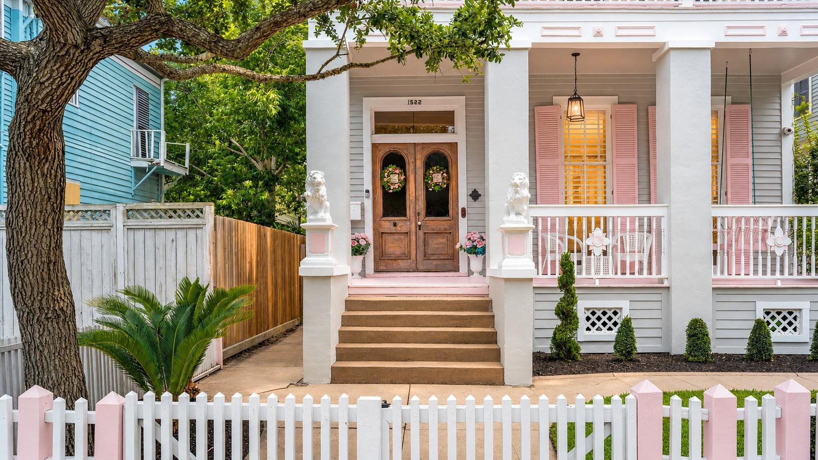 Image 2: Front exterior with white picket fence, steps to v