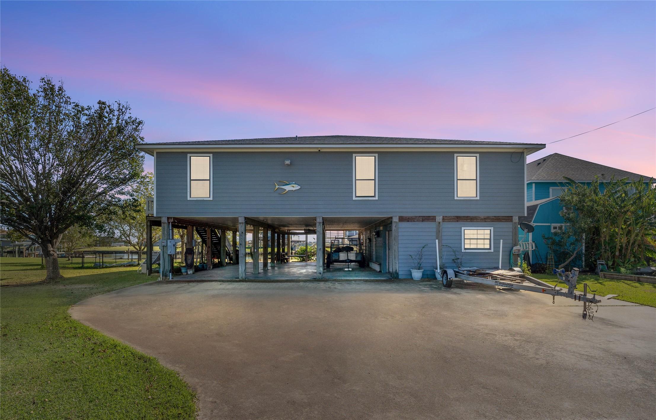 Image 2: This elevated home offers expansive under-house pa