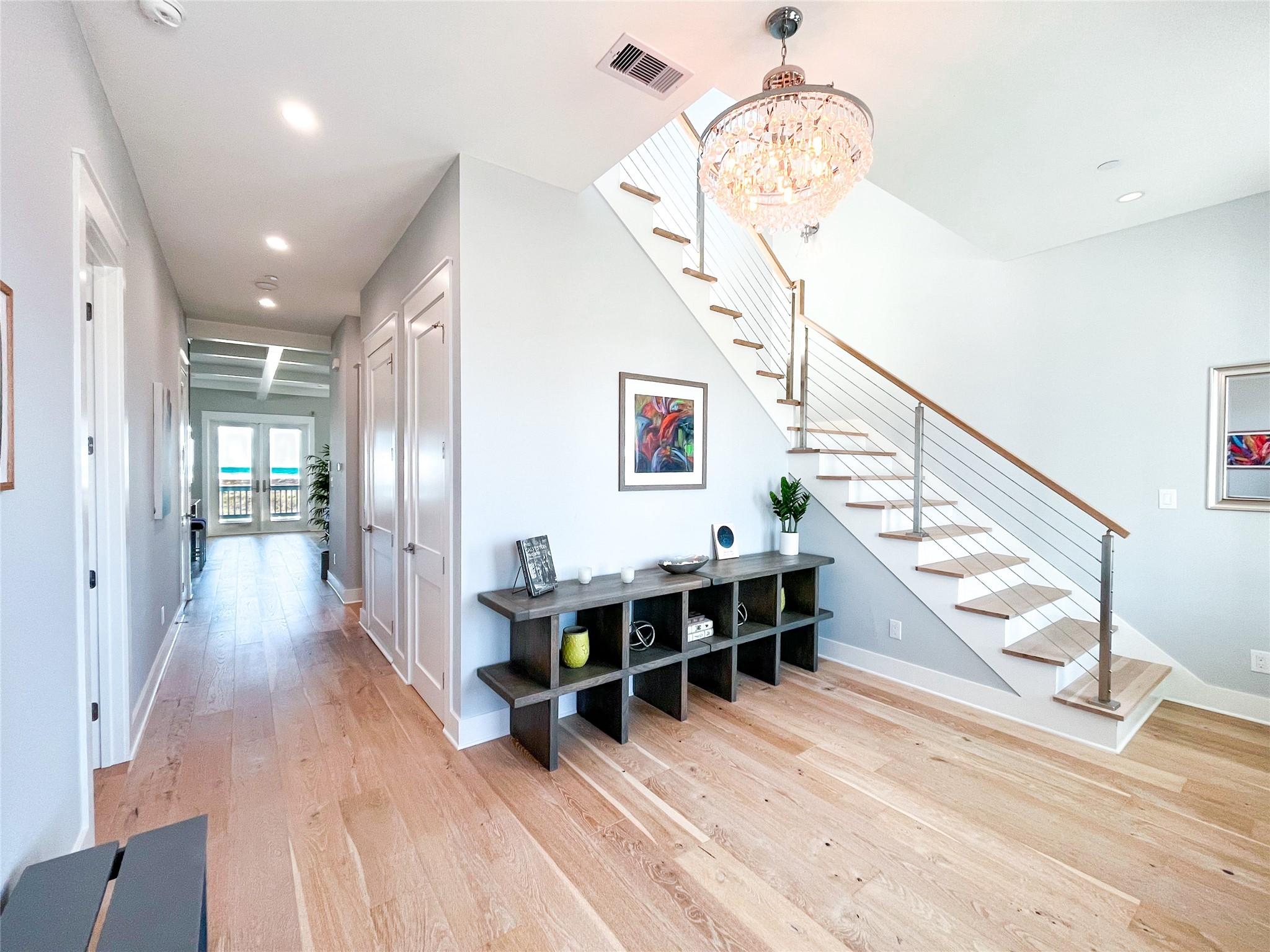 Image 3: A warm and welcoming foyer greets you upon entry,