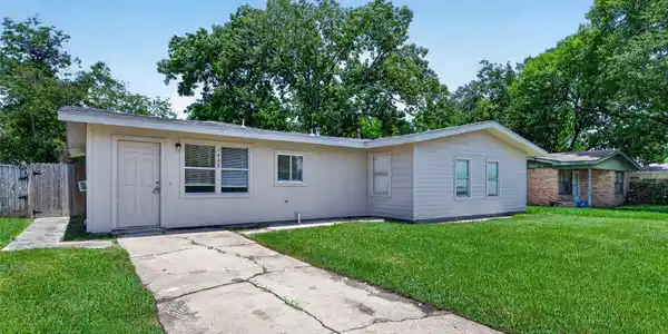 Image 3: Discover this charming single-story home featuring