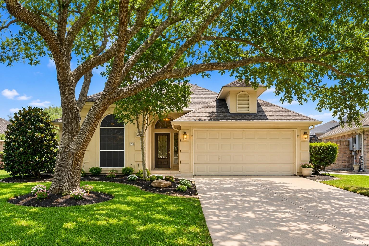 Image 1: Charming single-story home with a two-car garage,