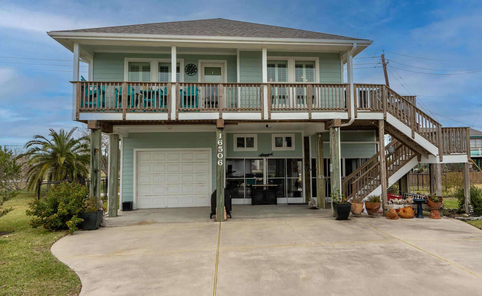 Image 2: Front of expansive property.  Enclosed area on the