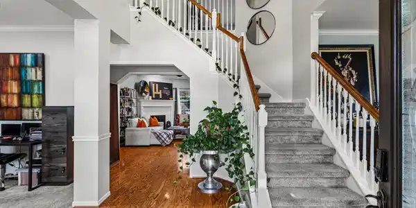 Image 3: Step inside to soaring ceilings, rich hardwood flo
