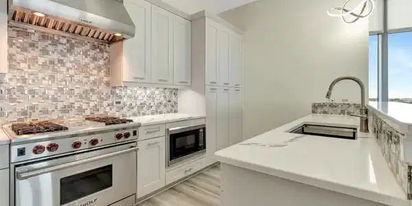 Image 3: The kitchen offers a Wolf stove, gas oven, microwa