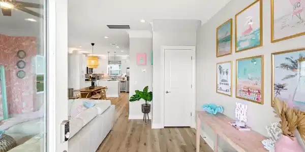 Image 2: Walking in, you find a bright entryway with beauti