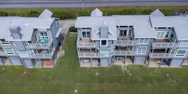 Image 4: This photo shows a pair of modern multi-story town