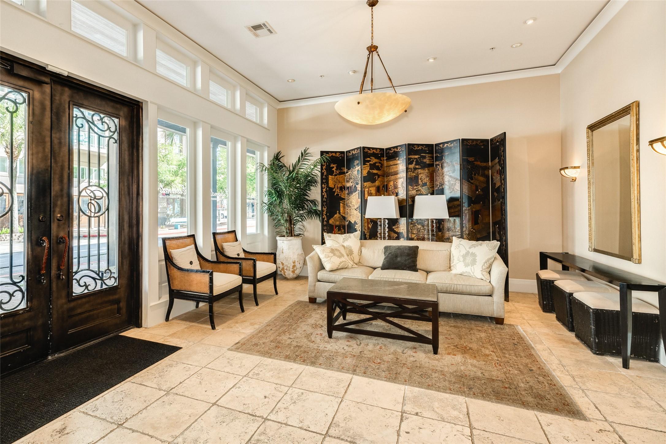 Image 2: Entry to building through double doors into this l