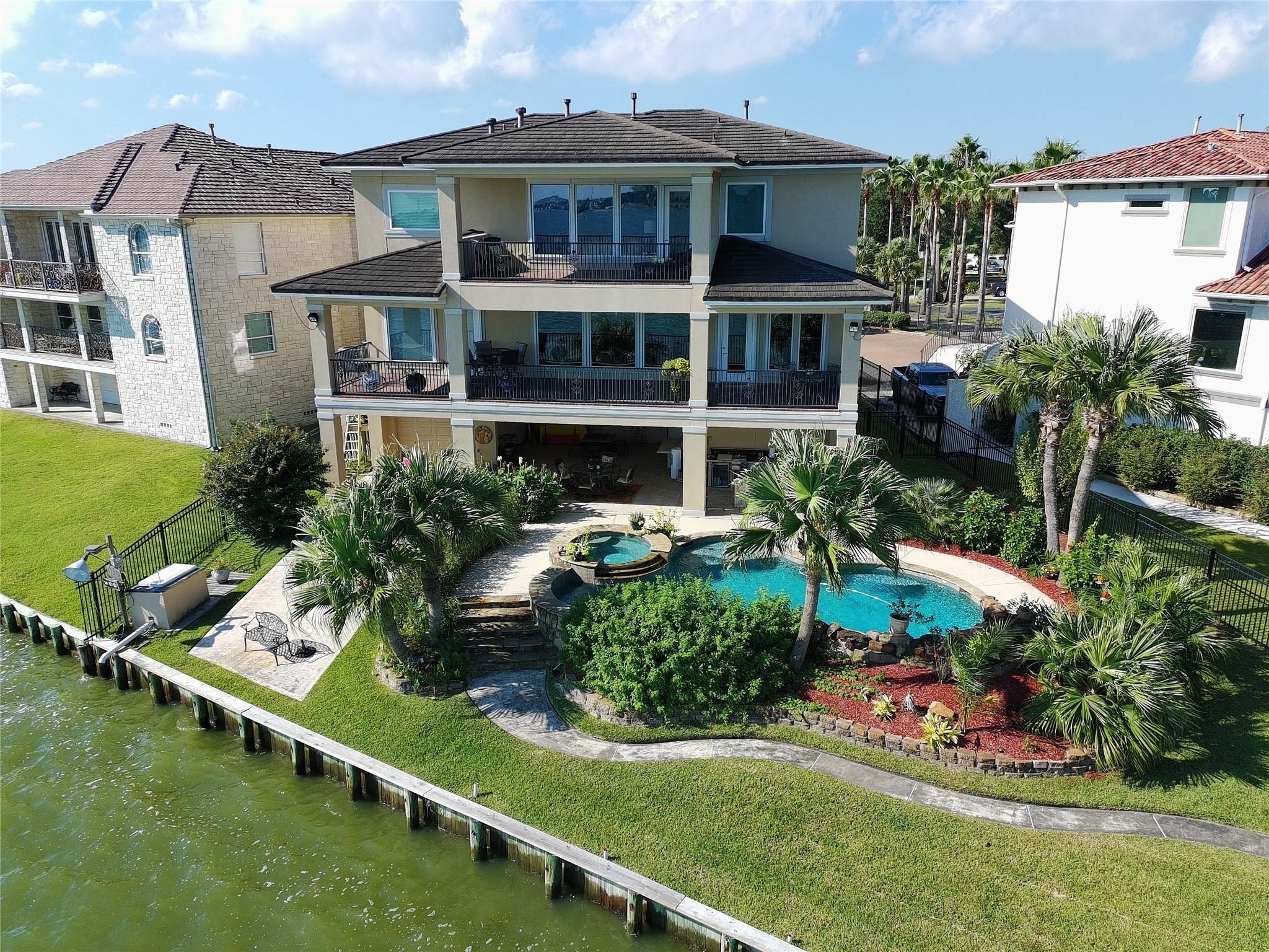 Image 1: Rear elevation of the home from the air.