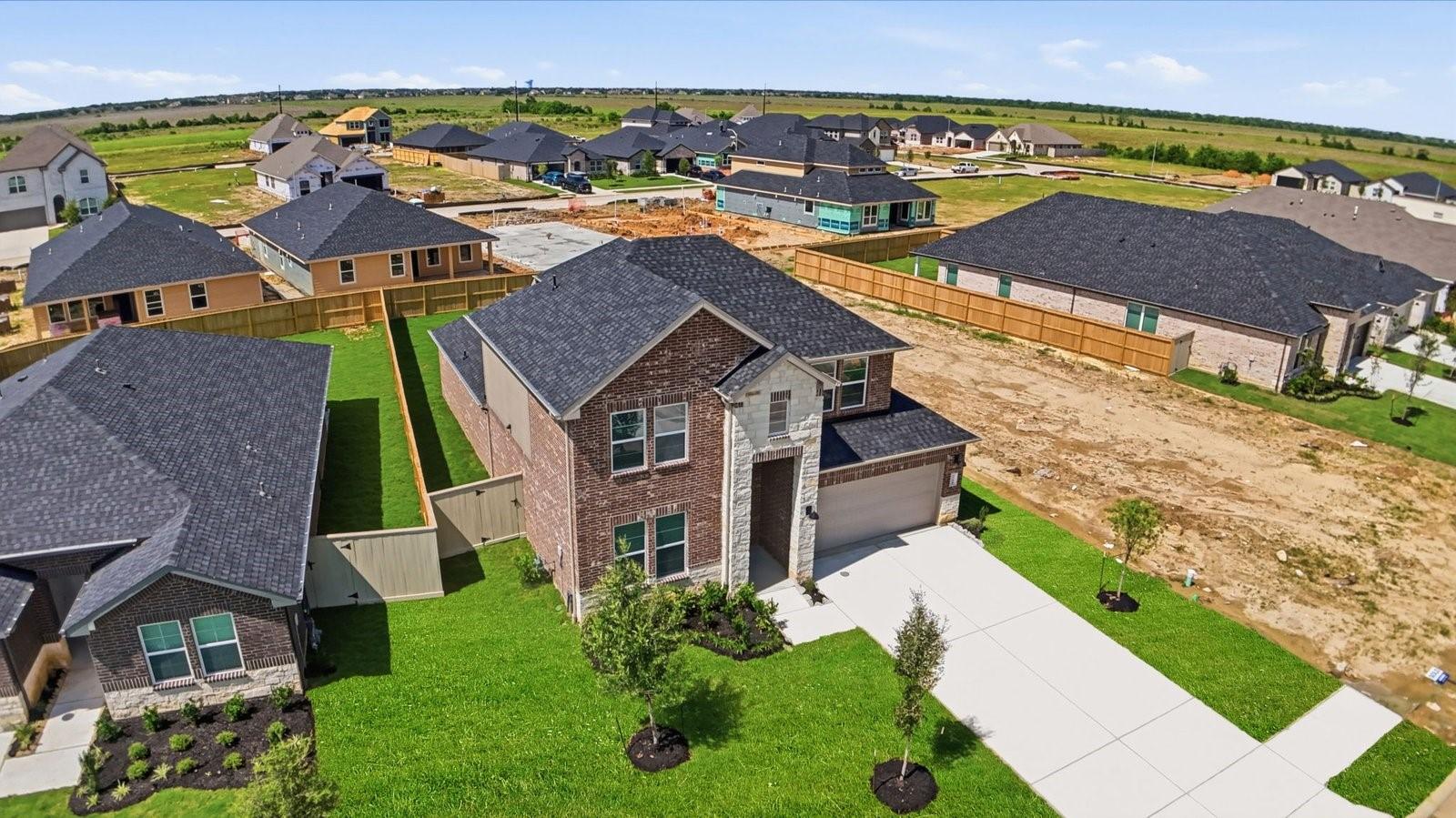 Image 2: An aerial view of the newly built one story home w