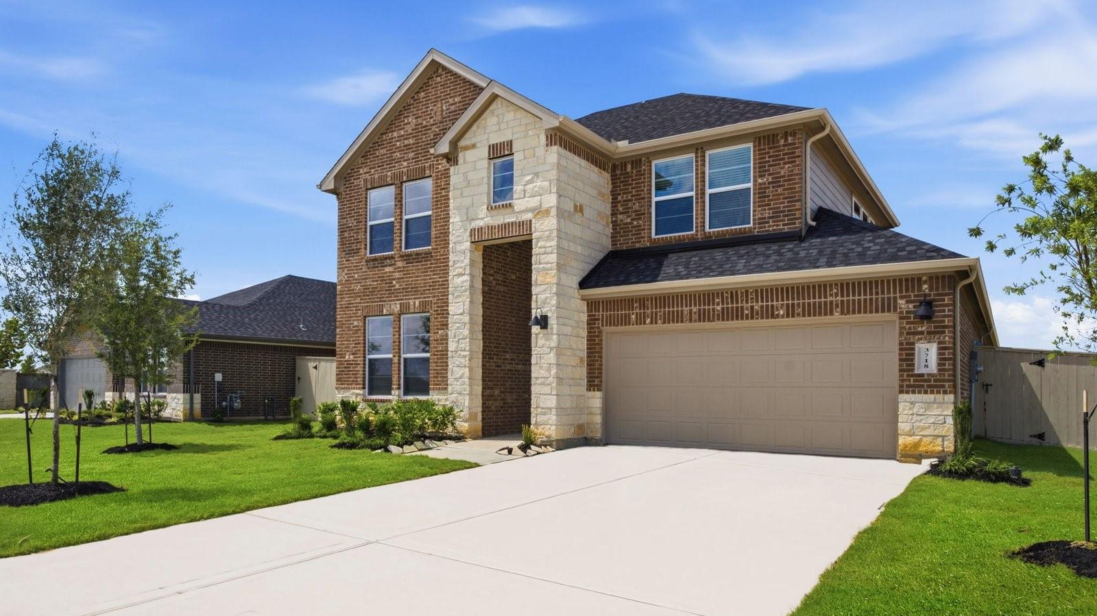 Image 3: Newly built two story home with traditional archit